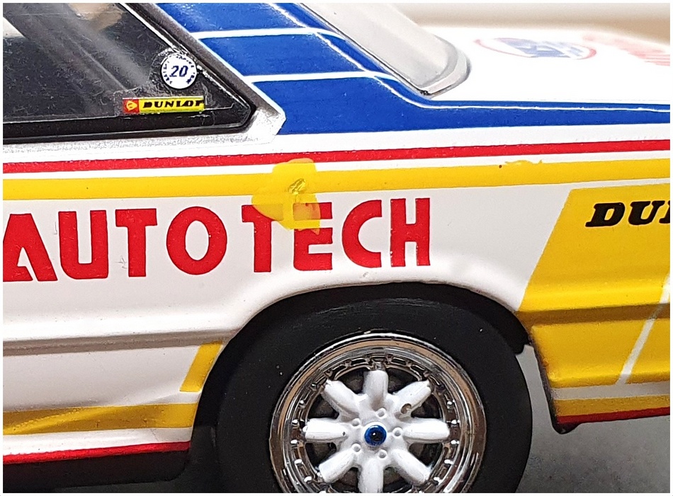 Kyosho 1/43 – Nissan Skyline RS Turbo #23 – Blanc/Bleu/Jaune – Occasion
